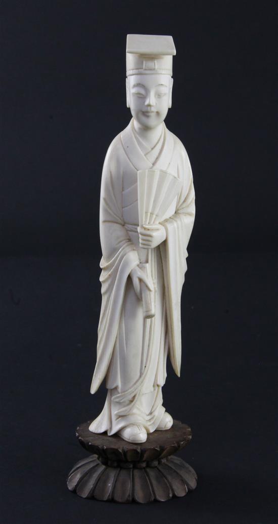 A Chinese ivory figure of a scholar, early 20th century, 17.5cm incl. stand, fitted box